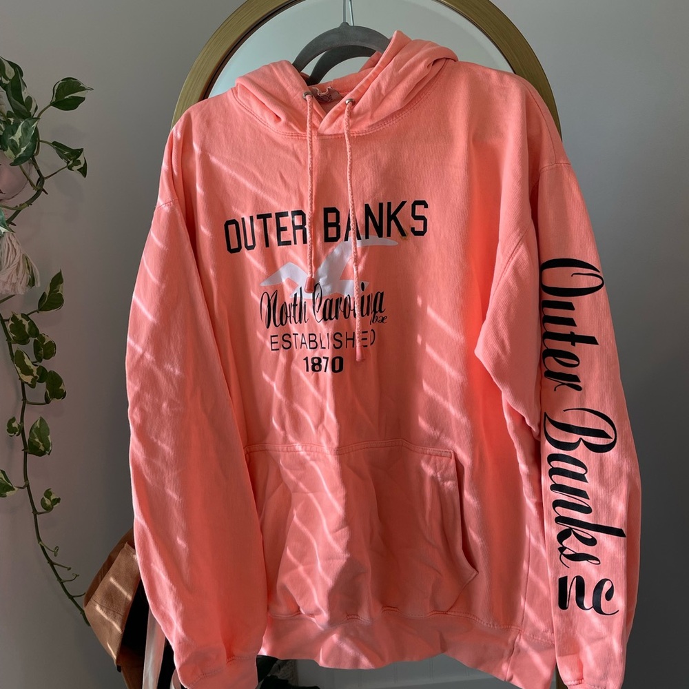 Peach colored Outer Banks sweatshirt, size L